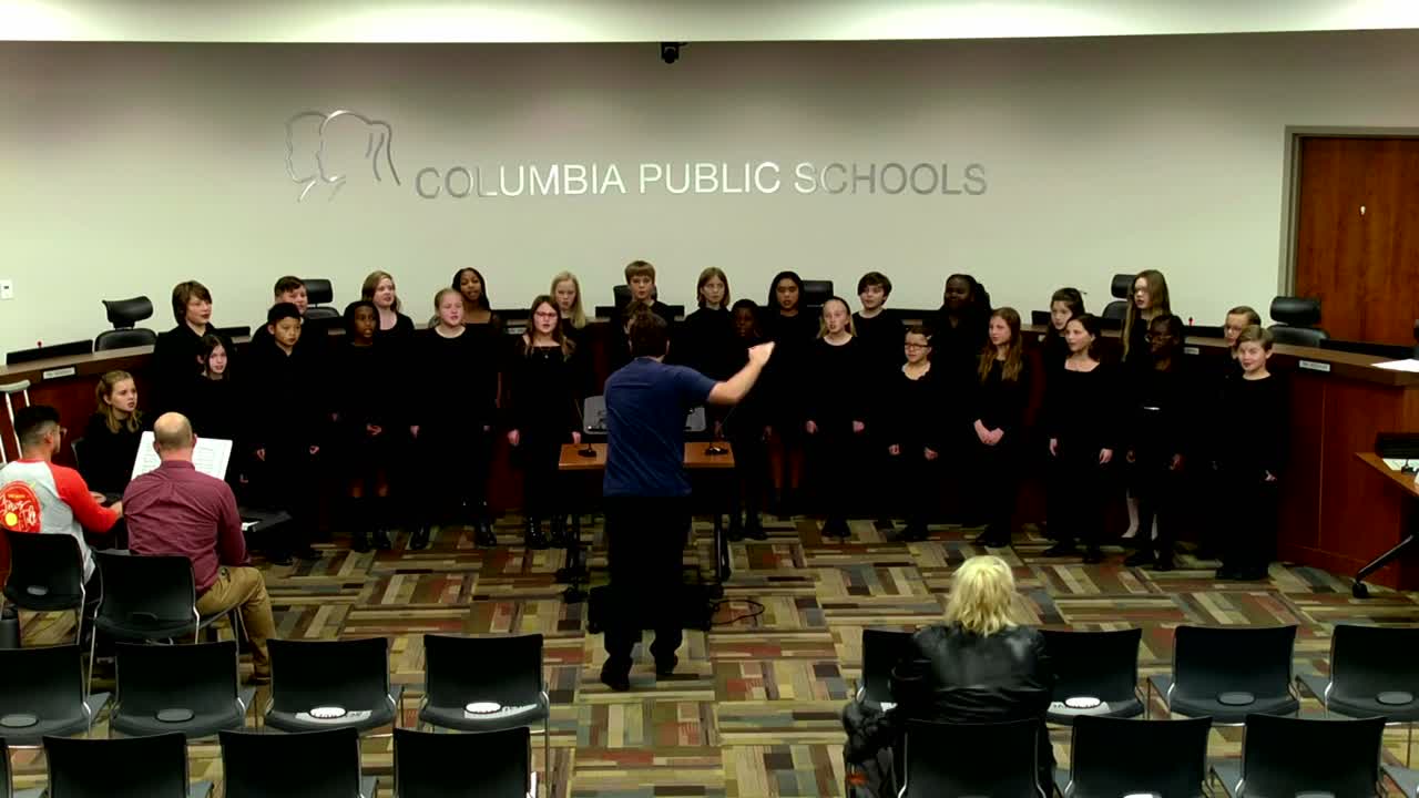 5th Grade Honor Choir Select performing in the school board room.