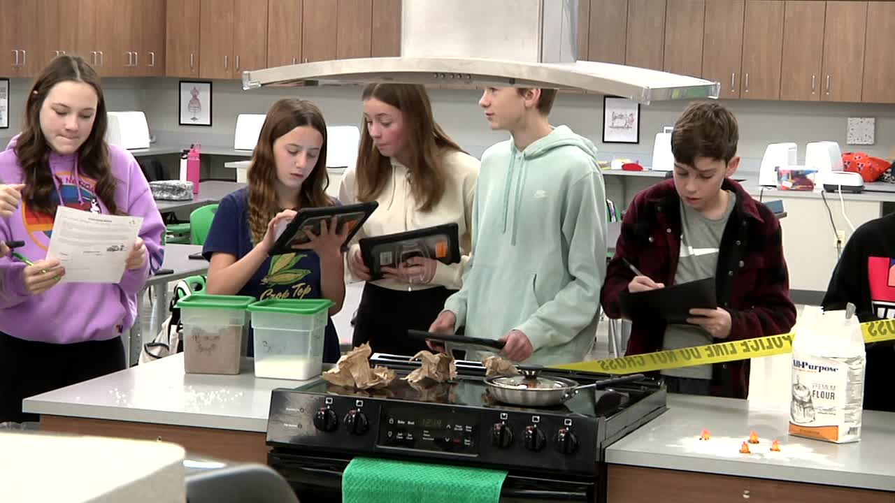 A group of JWMS student in a culinary art classroom.
